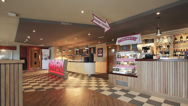 A restaurant with a checkered floor, a dessert counter, and a sign for 'Sweet Tooth?'. - Spring River Ebbsfleet by Marston's Inns (Gravesend)