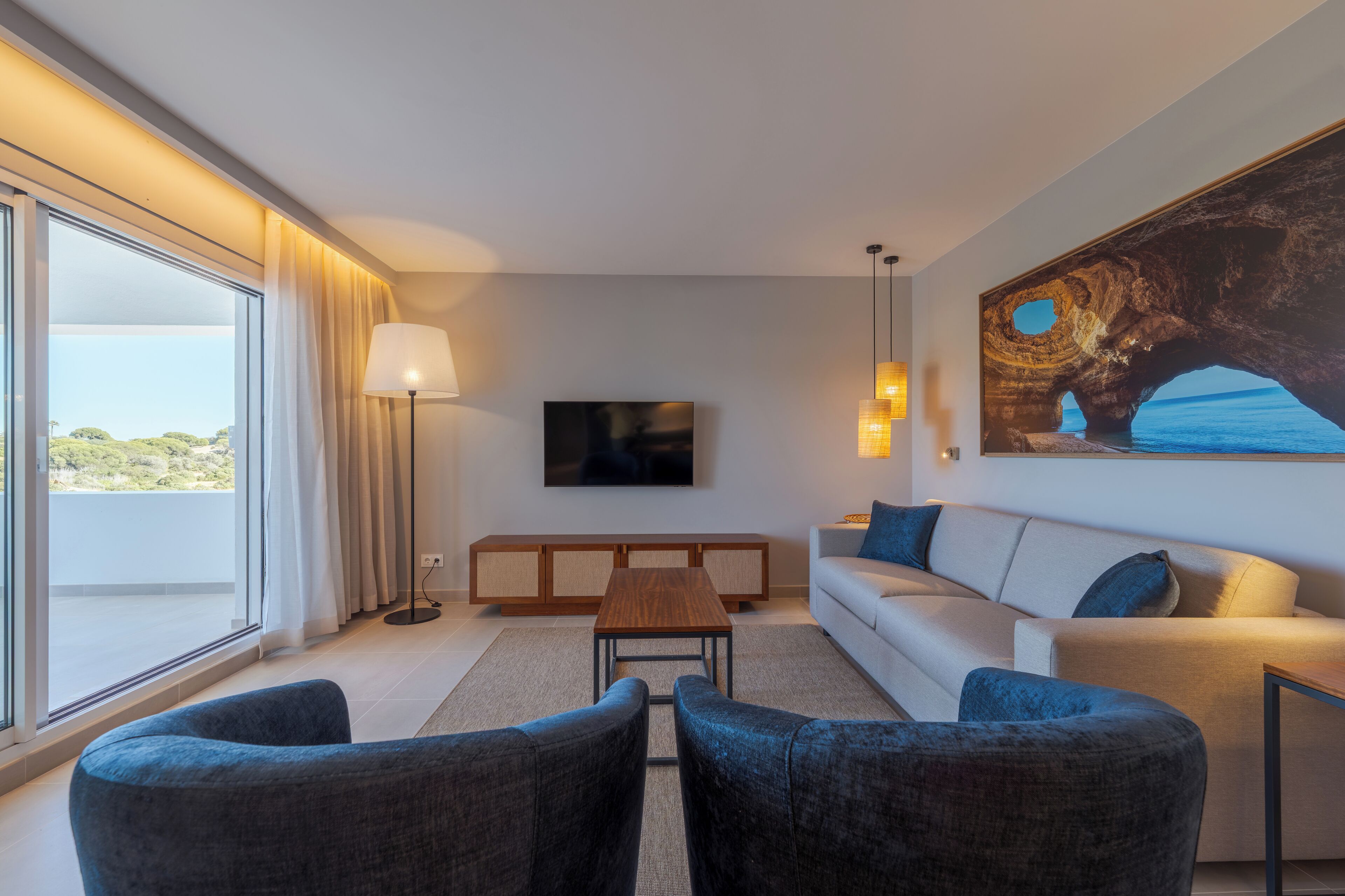 Premium Apartment, 1 Bedroom, Balcony, Beach View | Living area | Flat-screen TV, books