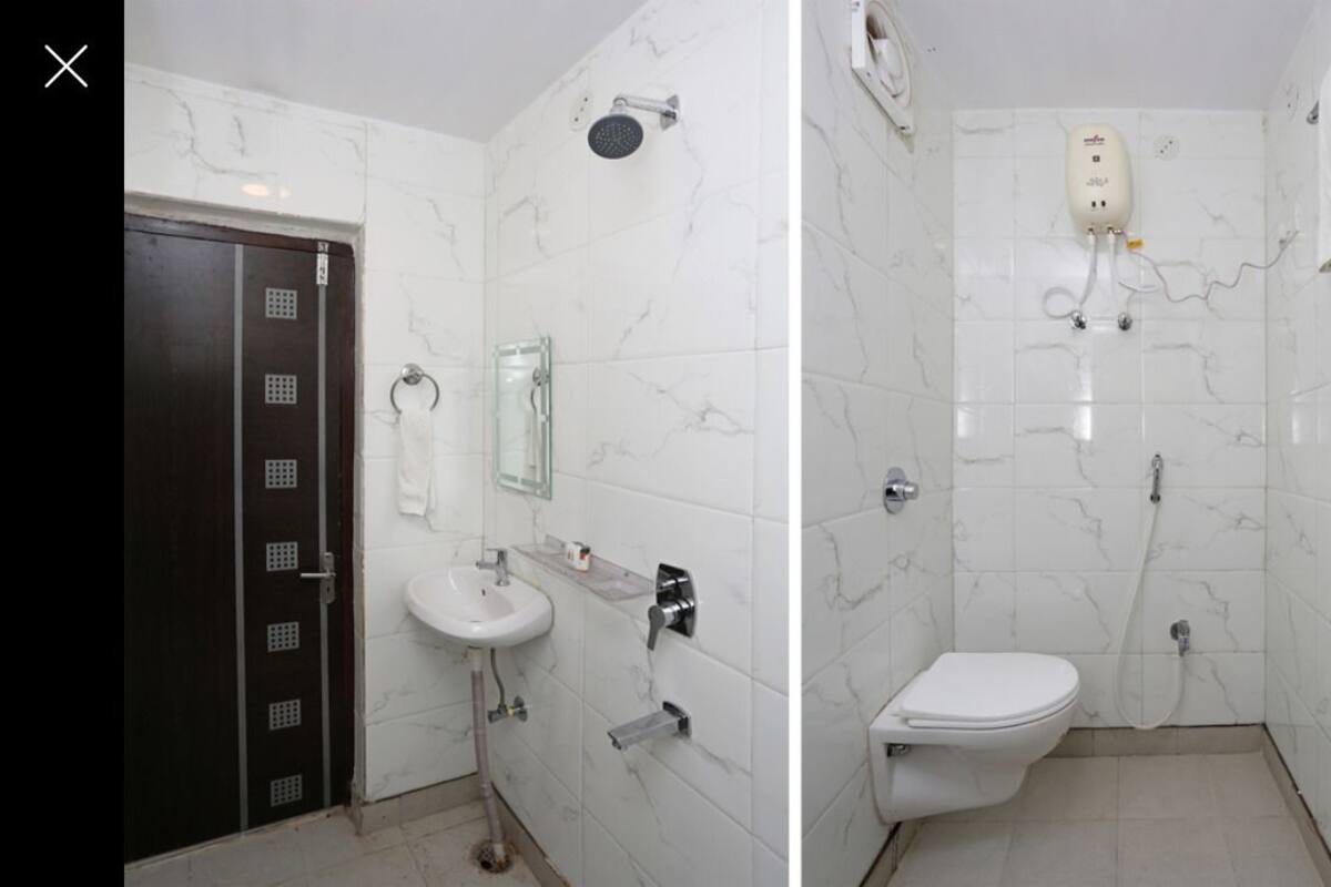 A bathroom with a sink, toilet, and shower.