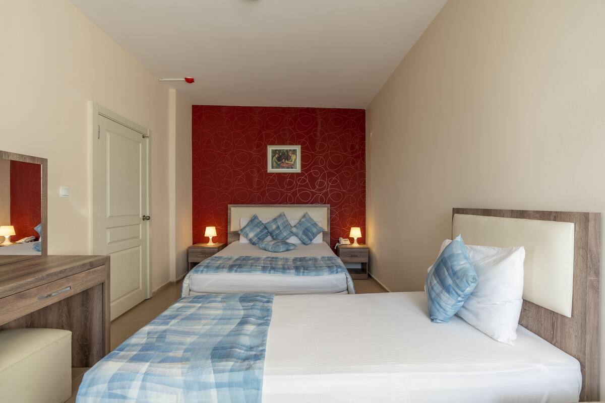 Suite Familiale, plusieurs lits | Vue de la chambre