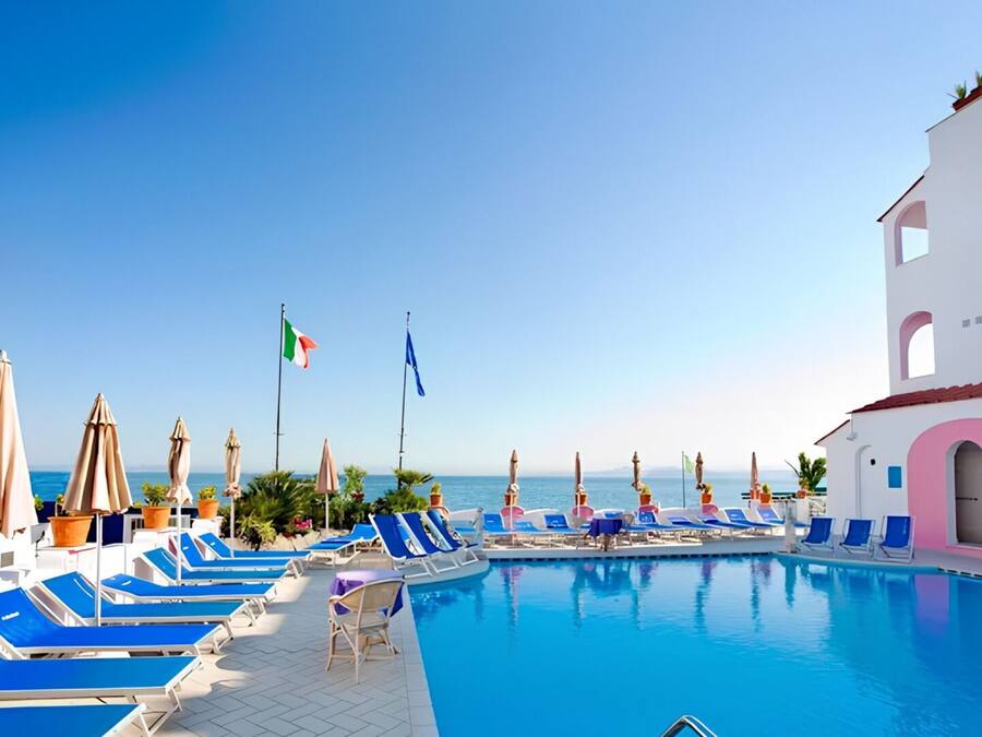 2 indoor pools, 2 outdoor pools, open 9 AM to 7 PM, pool umbrellas