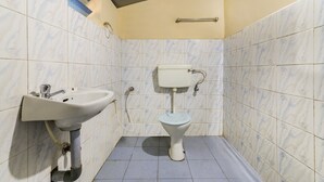 A bathroom with a sink, toilet, and a towel rack. - GuestHouser 4 BHK Homestay f531 (Devikolam)