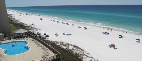 Private beach, white sand, sun loungers, beach umbrellas