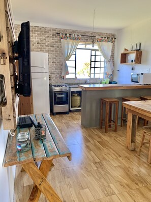 Full-size fridge, microwave, cookware/dishes/utensils