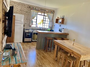 Full-size fridge, microwave, cookware/dishes/utensils