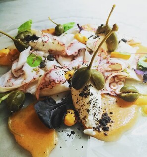 A seafood dish with various toppings and a sauce. - Villa Shelley Boutique Hotel (Lerici)