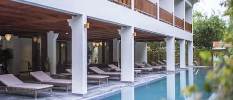 Indoor pool, open 7 AM to 9 PM, pool umbrellas, sun loungers