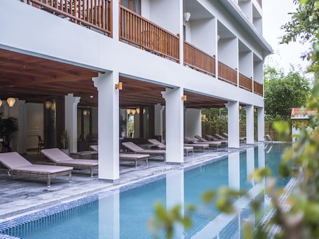 Indoor pool, open 7 AM to 9 PM, pool umbrellas, sun loungers