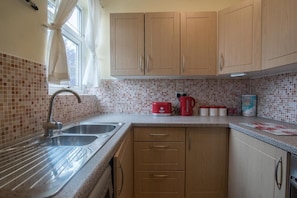 Fridge, microwave, cookware/dishes/utensils
