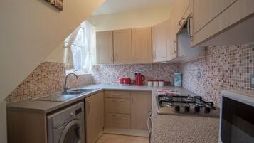 Fridge, microwave, cookware/dishes/utensils