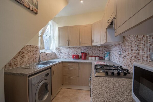 Fridge, microwave, cookware/dishes/utensils