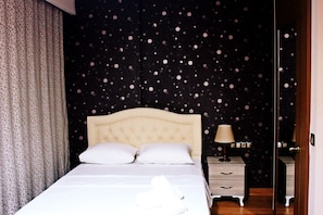 Desk, blackout curtains, soundproofing, bed sheets