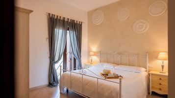 Luxury Suite, 2 Bedrooms, Patio | Individually decorated, desk, blackout drapes, soundproofing