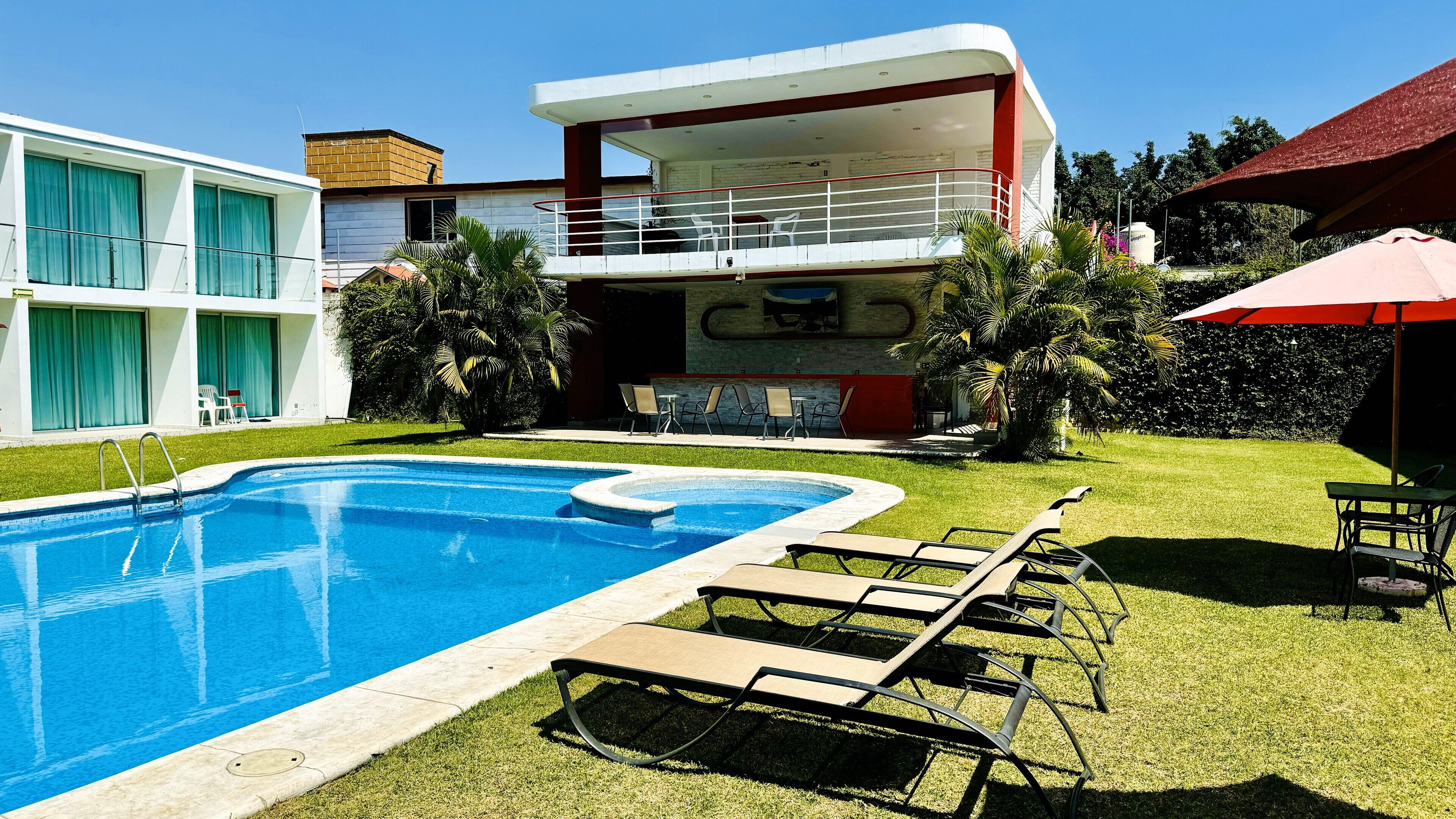 Outdoor pool, pool umbrellas, pool loungers