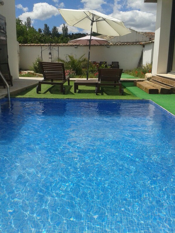 Seasonal outdoor pool, pool umbrellas, pool loungers