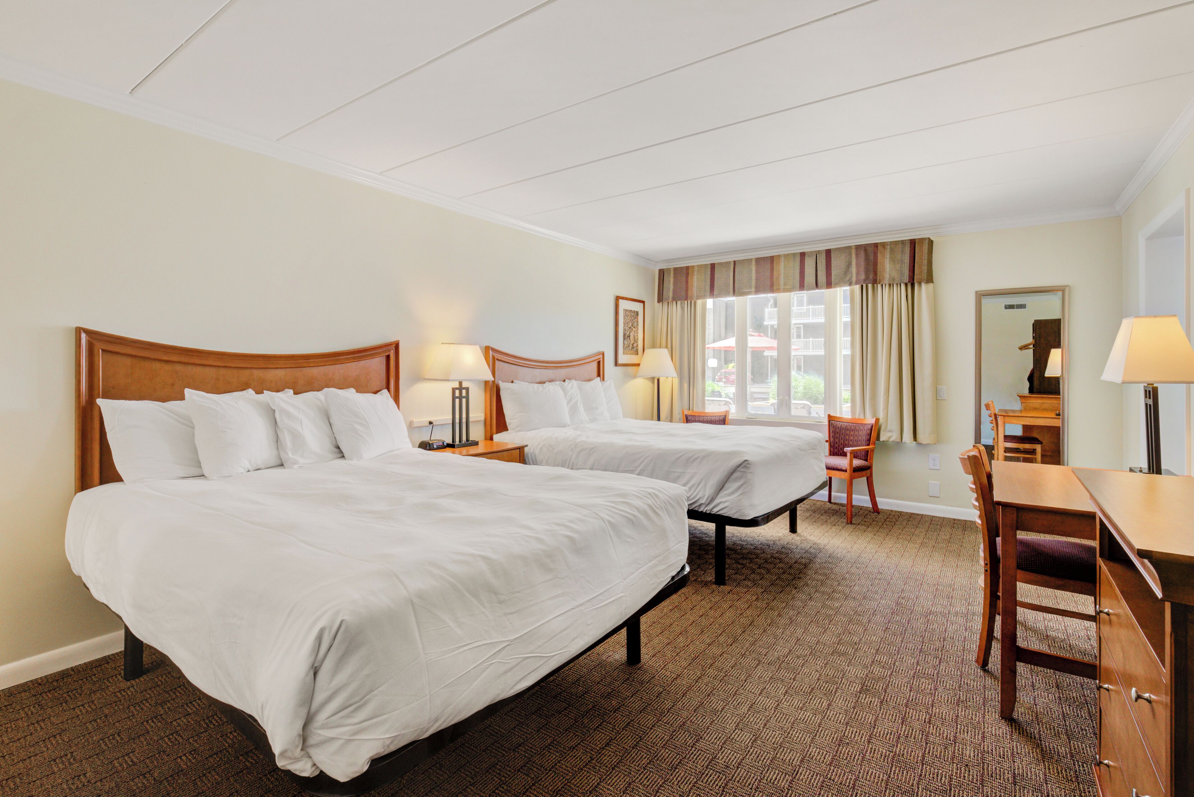 family suite, multiple beds | blackout curtains, iron/ironing board, bed sheets