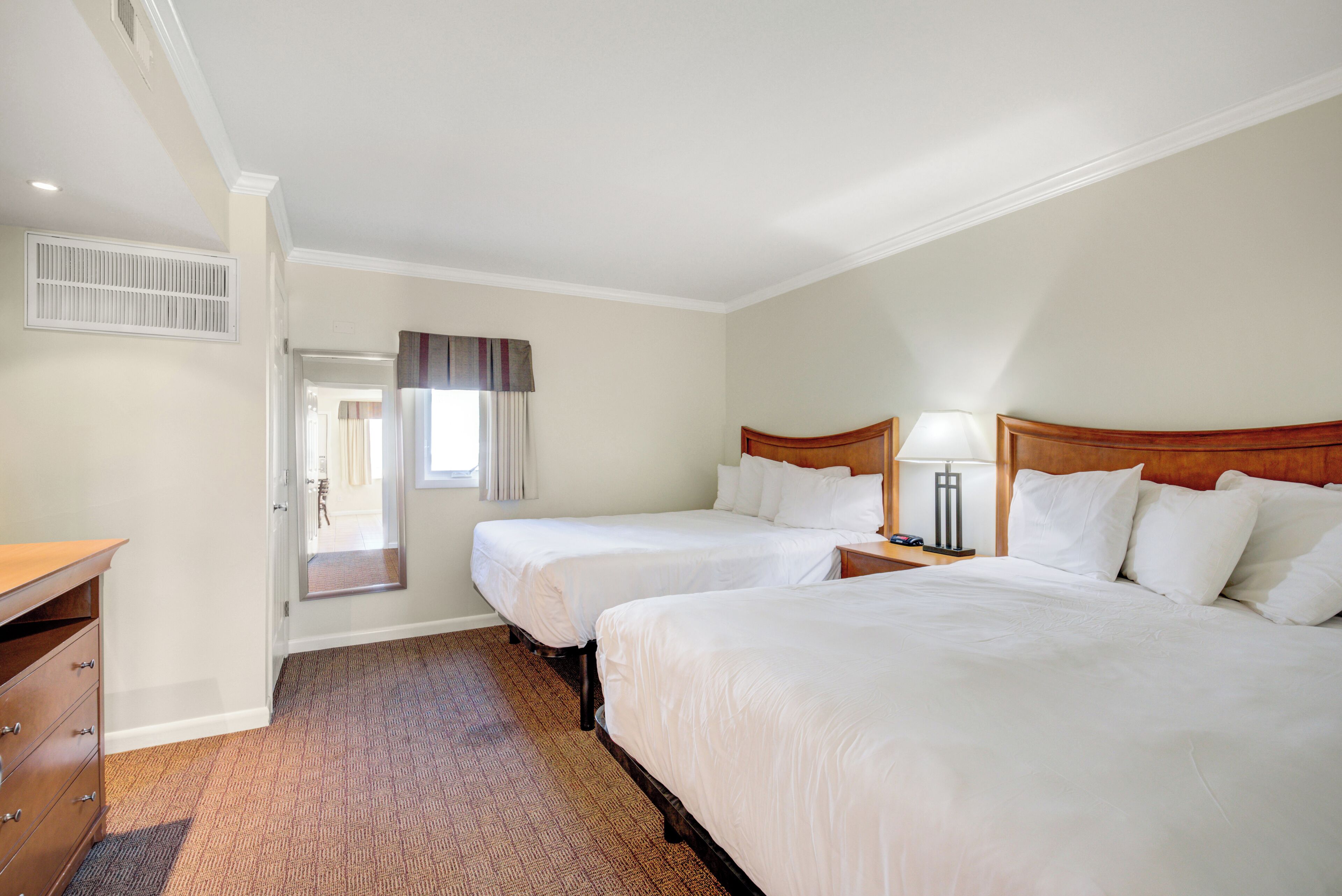 premium suite, multiple beds | blackout curtains, iron/ironing board, bed sheets
