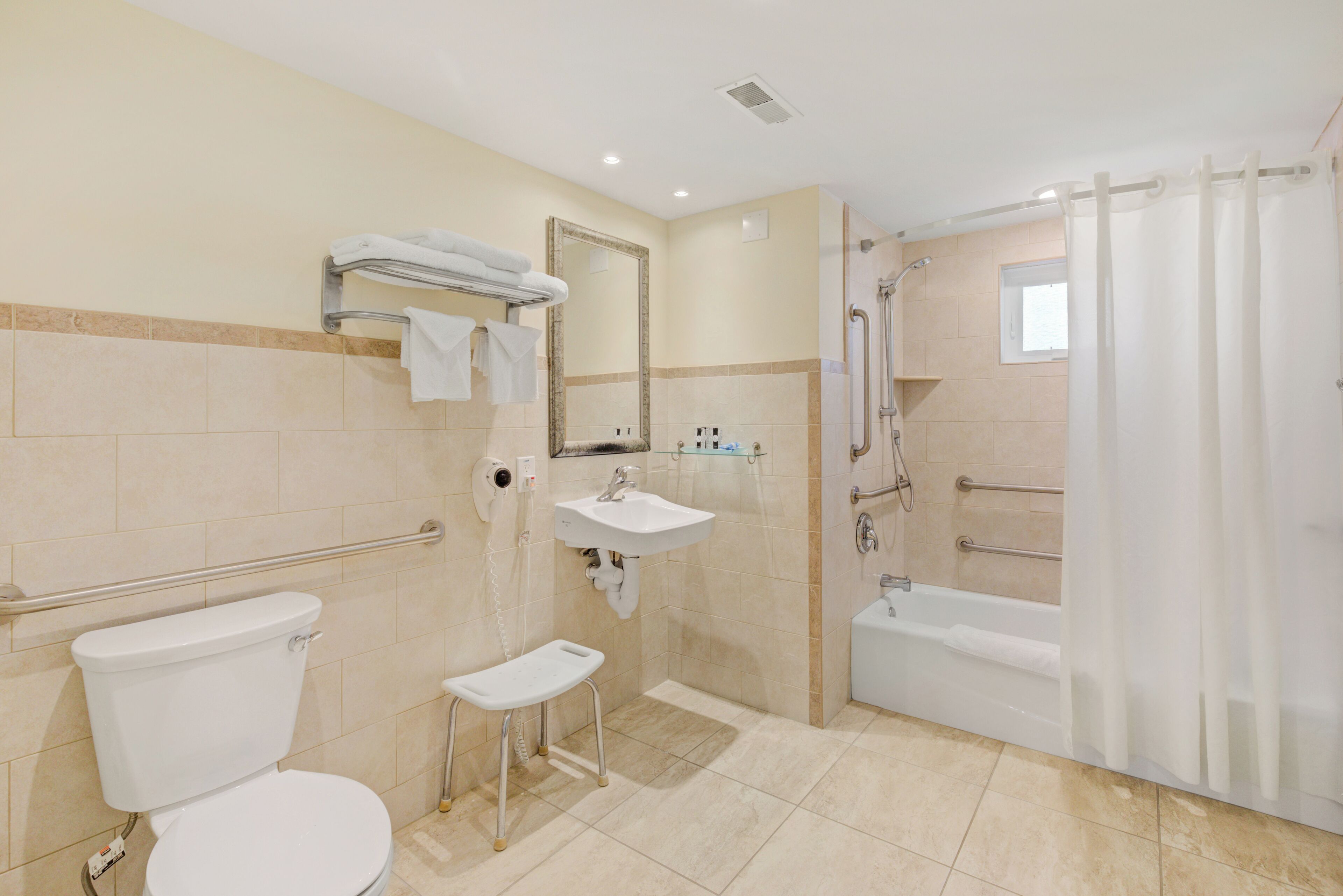 family suite, multiple beds | bathroom | bathtub, free toiletries, hair dryer, towels
