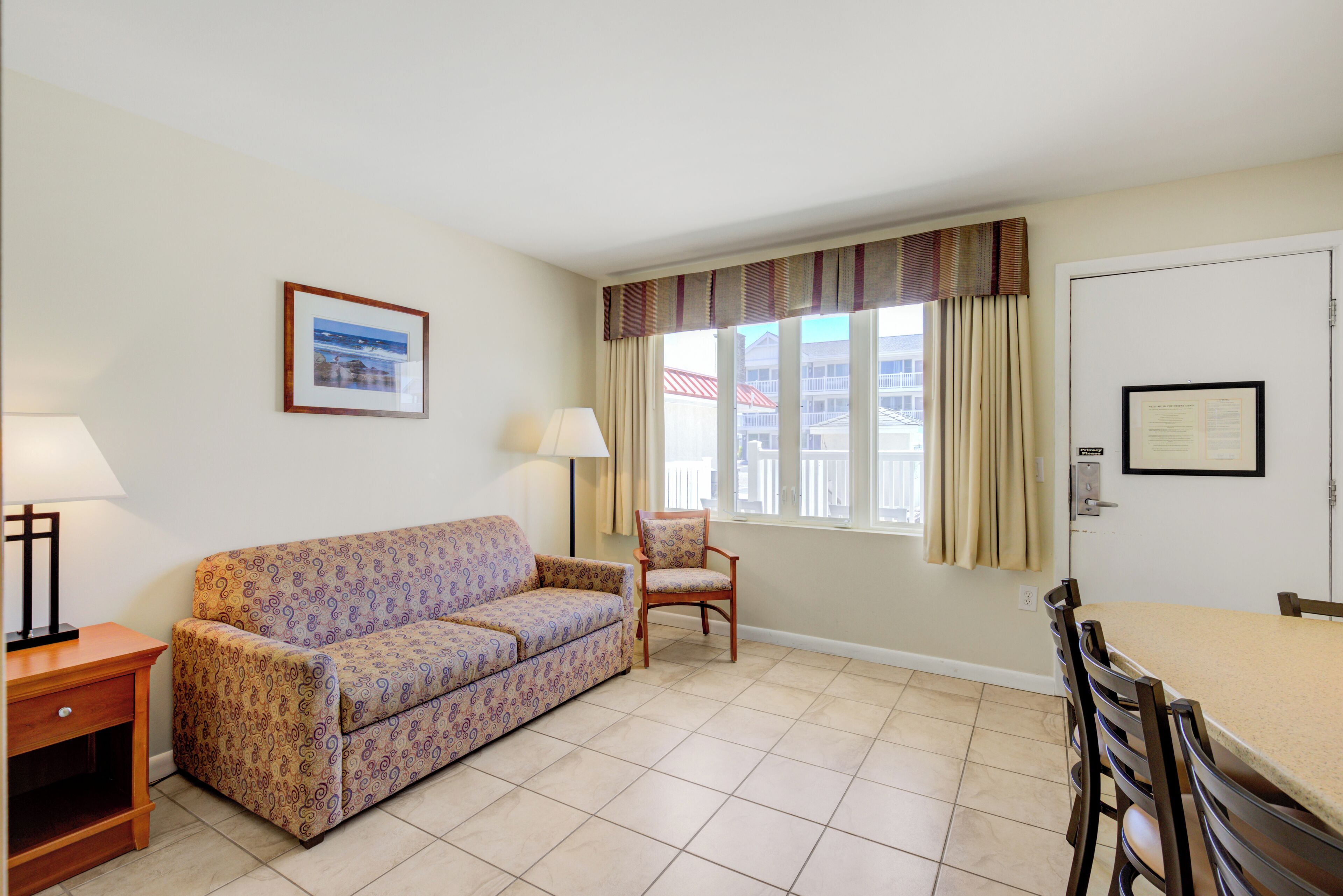 classic suite, multiple beds | living area | flat-screen tv