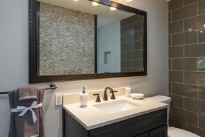 Shower, hair dryer, towels, shampoo