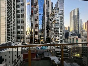 Experience the vibrant city from a high-rise perspective with stunning views of the urban landscape.