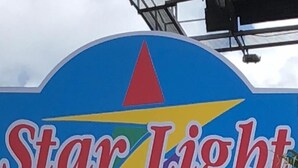 A Star Light Inn sign with a colorful star design. - Star Light Inn (Channelview)