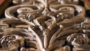 A close-up of ornate metalwork with intricate designs and patterns.