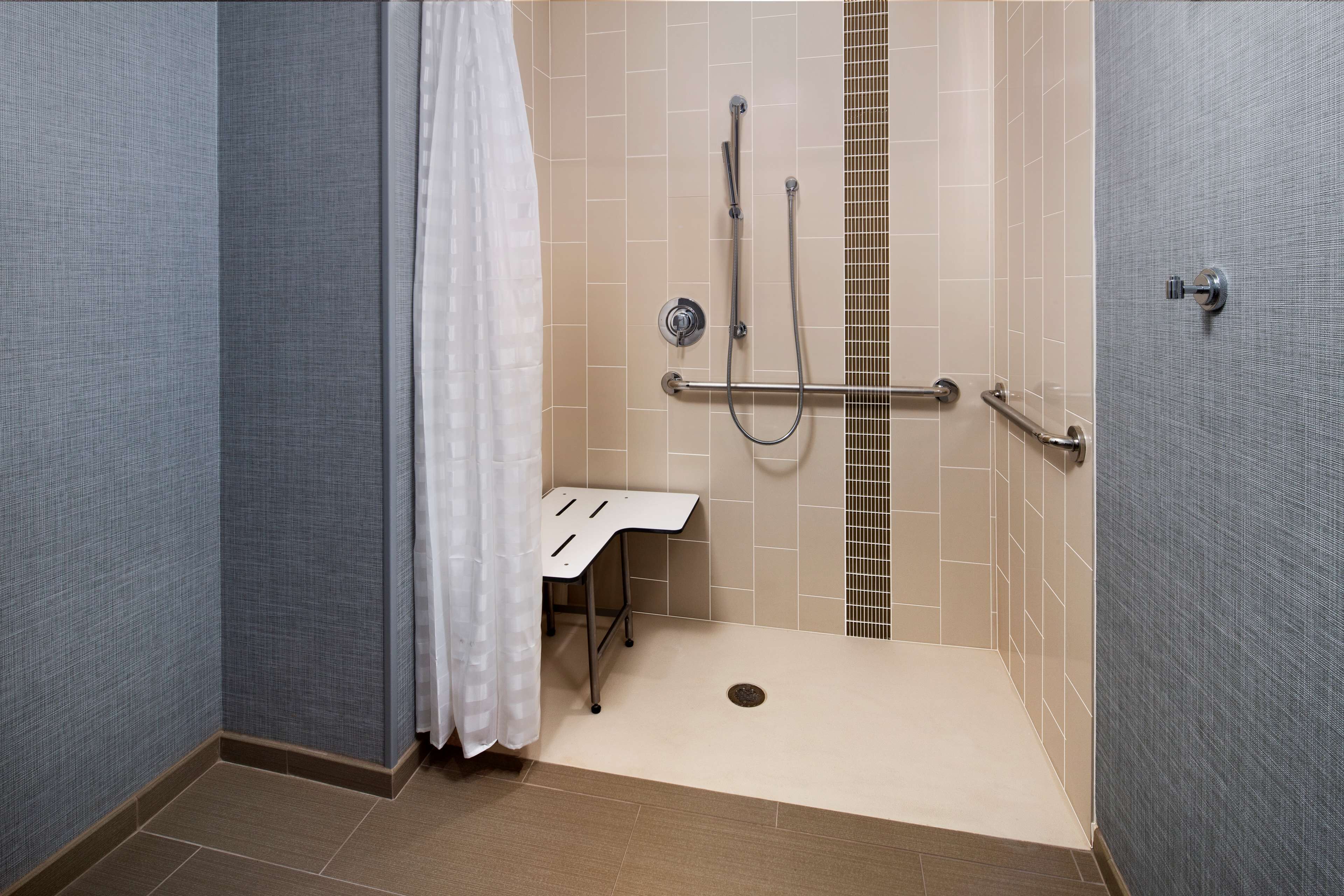 designer toiletries, hair dryer, towels, soap