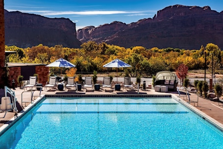 Seasonal outdoor pool, open 8:00 AM to 10:00 PM, free cabanas