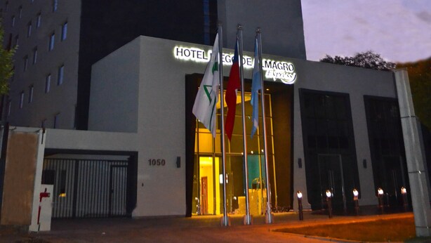 A modern hotel building with a prominent sign for Hotel Diego de Almagro Express.