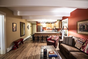 Cozy living space with a central island kitchen and open layout.