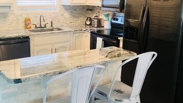Coffee/tea maker, fridge, microwave, oven