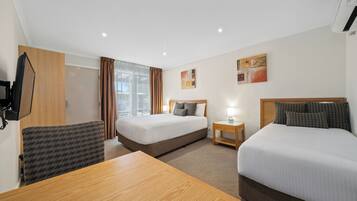Deluxe Queen and Single | 2 bedrooms, blackout drapes, iron/ironing board, free WiFi