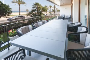 Enjoy a meal or a moment of tranquility on this spacious balcony overlooking the beach.