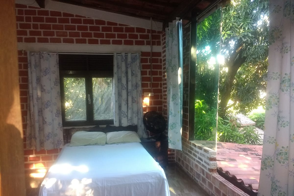 Panoramic Tree House, 1 Double Bed, Garden View | 1 bedroom, iron/ironing board, cribs/infant beds, rollaway beds