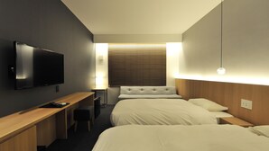 A hotel room with a bed, a desk, a TV, and a window with blinds. - FUGASTAY Shijo Omiya (Kyoto)