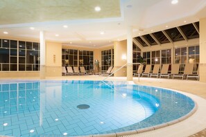 Indoor pool, open 7:00 AM to 9:00 PM, pool umbrellas, pool loungers