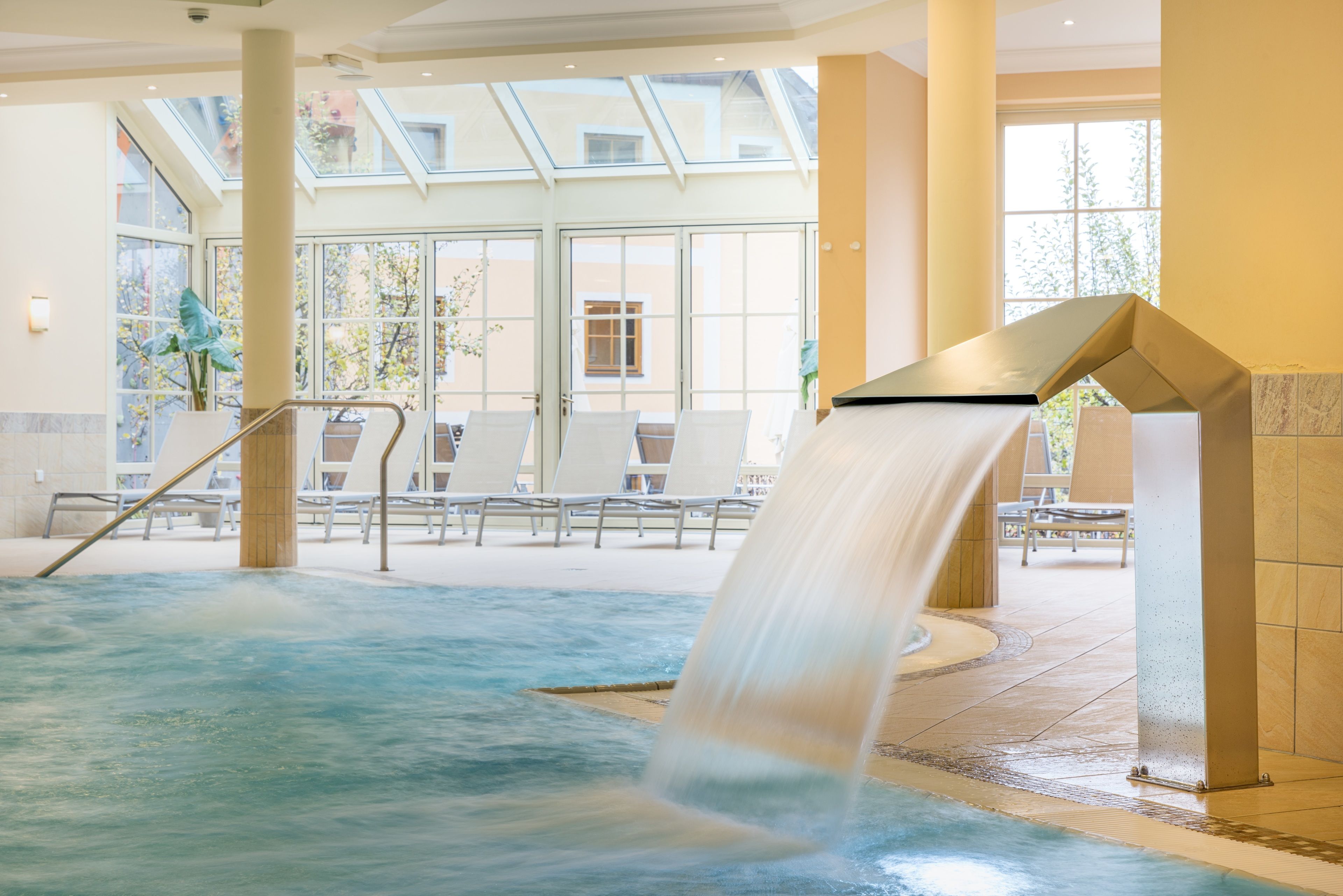 Indoor pool, open 7:00 AM to 9:00 PM, pool umbrellas, sun loungers