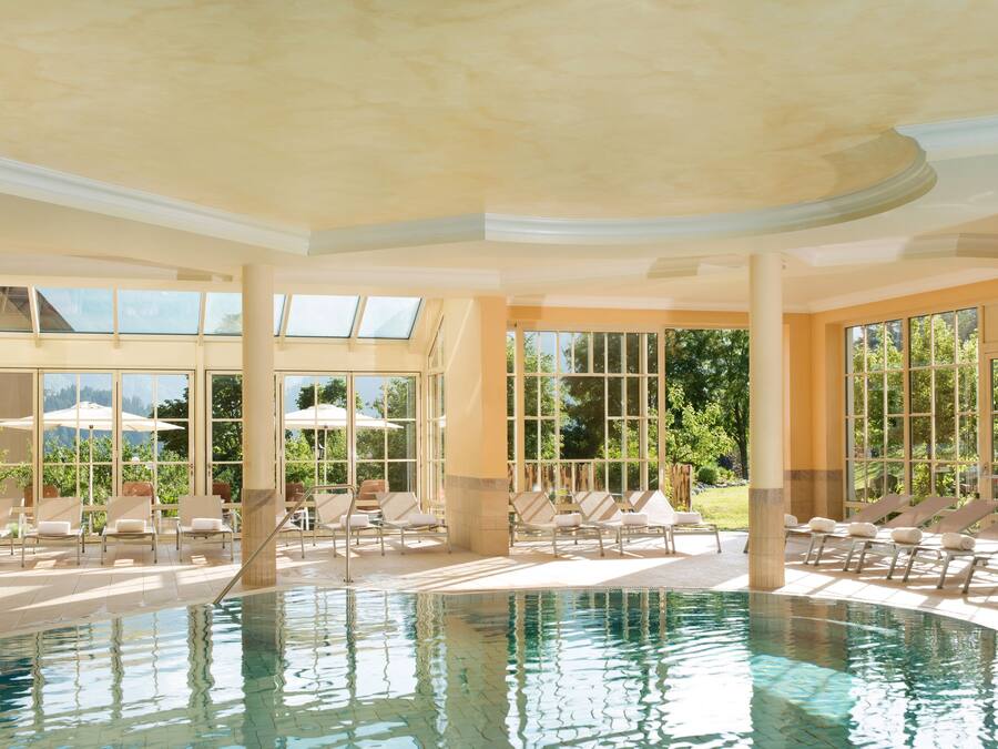 Indoor pool, open 7:00 AM to 9:00 PM, pool umbrellas, sun loungers