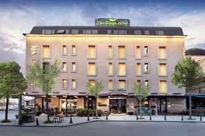 A hotel with a flat facade, multiple windows, and a sign reading 'The Wings Hotel.' - The Wings Hotels Karakoy (Istanbul)