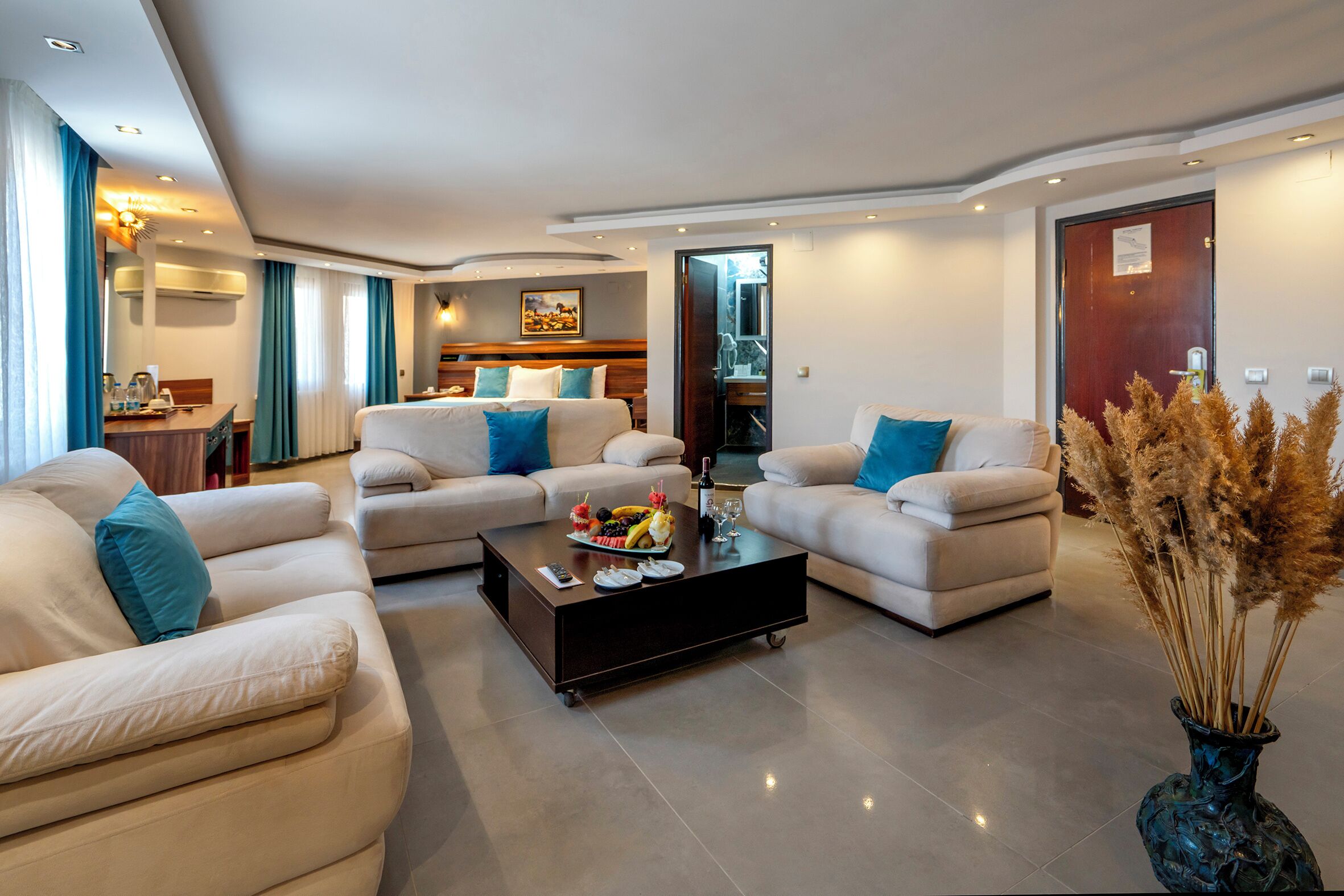 Executive Suite, 1 Bedroom | Living area | LCD TV, foosball, table tennis, books