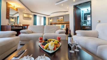 Executive Suite, 1 Bedroom | Living area | LCD TV, table football, ping pong, books