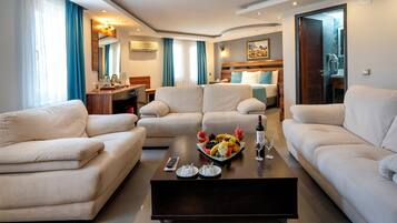 Executive Suite, 1 Bedroom | Living area | LCD TV, foosball, table tennis, books