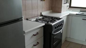 Fridge, coffee/tea maker, cookware/dishes/utensils