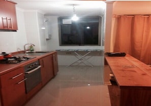 Full-sized fridge, microwave, coffee/tea maker, cookware/dishes/utensils