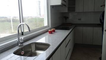 Full-size fridge, coffee/tea maker, cookware/dishes/utensils