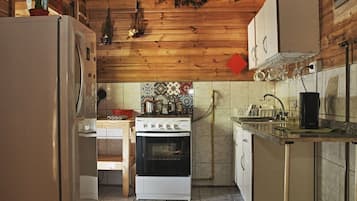 Full-sized fridge, microwave, coffee/tea maker, cookware/dishes/utensils