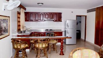 Full-sized fridge, microwave, coffee/tea maker, cookware/dishes/utensils