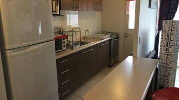 Full-sized fridge, coffee/tea maker, cookware/dishes/utensils