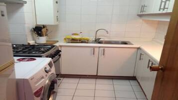 Full-size fridge, coffee/tea maker, cookware/dishes/utensils